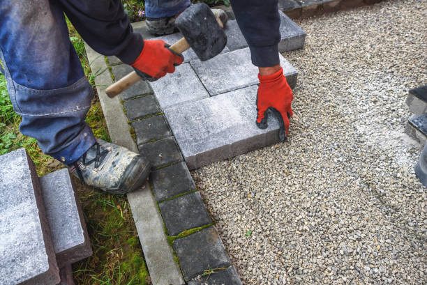 Installing paving stones during Brampton garden suite construction