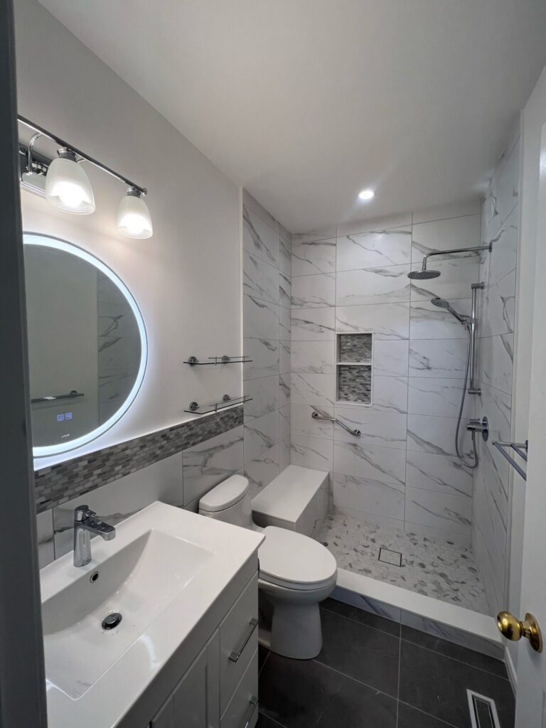 Modern bathroom renovation in Kleinburg with walk-in shower and vanity