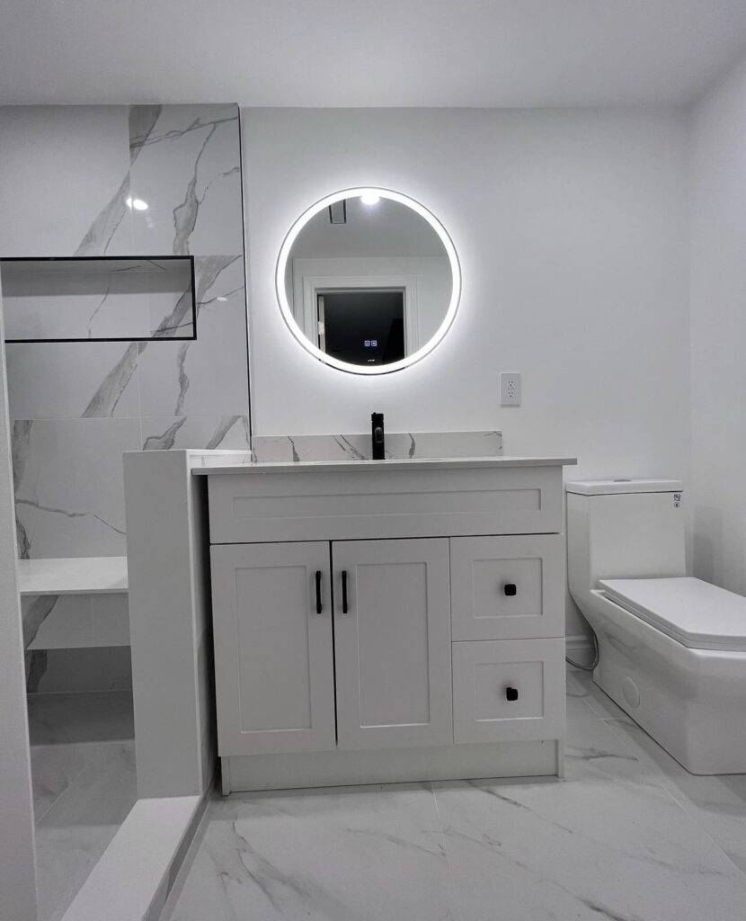 Modern bathroom renovation in Brampton with freestanding tub and tile upgrades