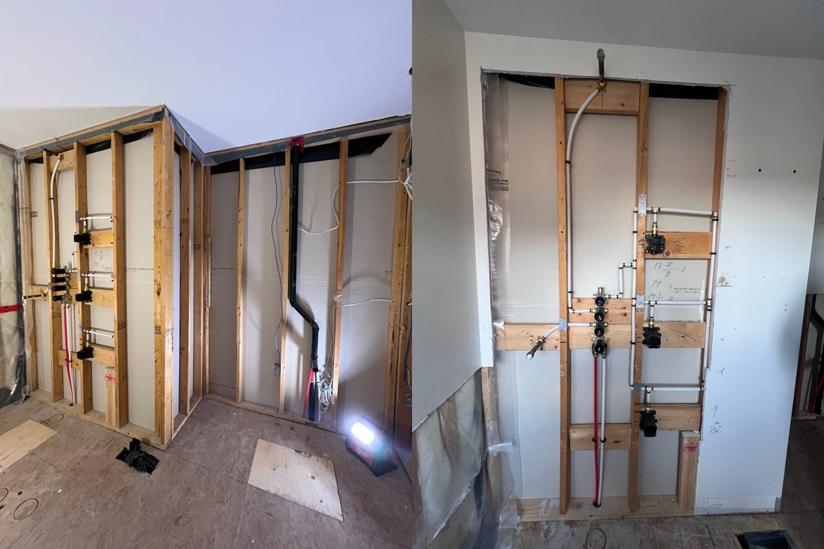 Bathroom renovation in Richmond Hill showing plumbing rough-in and framing stage for shower system and fixture layout by Renotec