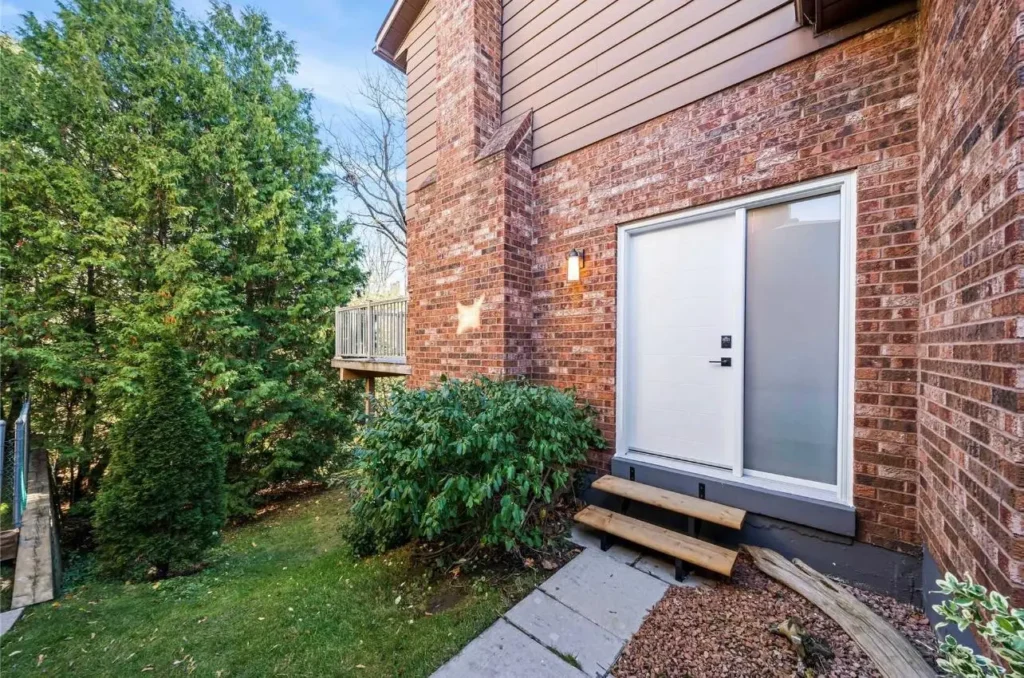 Basement walkout entrance renovation by Renotec with exterior access and backyard view